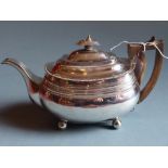 A George III hallmarked silver tea pot by Robert Hennell and retailed by Hancock Ltd