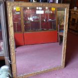 A 20th century wall mirror the rectangular plate within ornate gilt frame