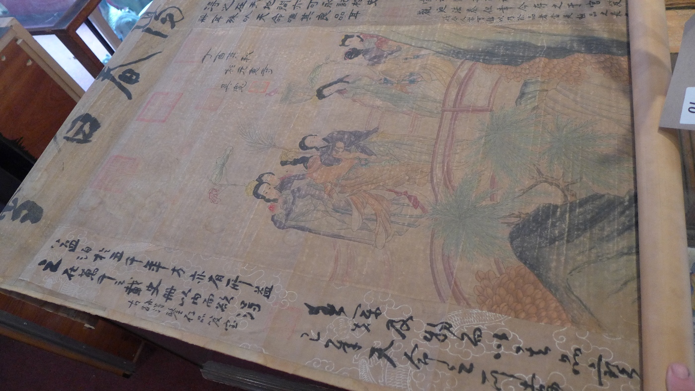 A Chinese hand painted scroll depicting a figural scene