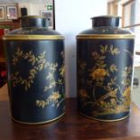 A pair of Victorian style Toleware tea canisters decorated with birds amongst flowering plants