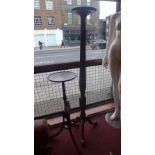A mahogany torchere with reeded column a