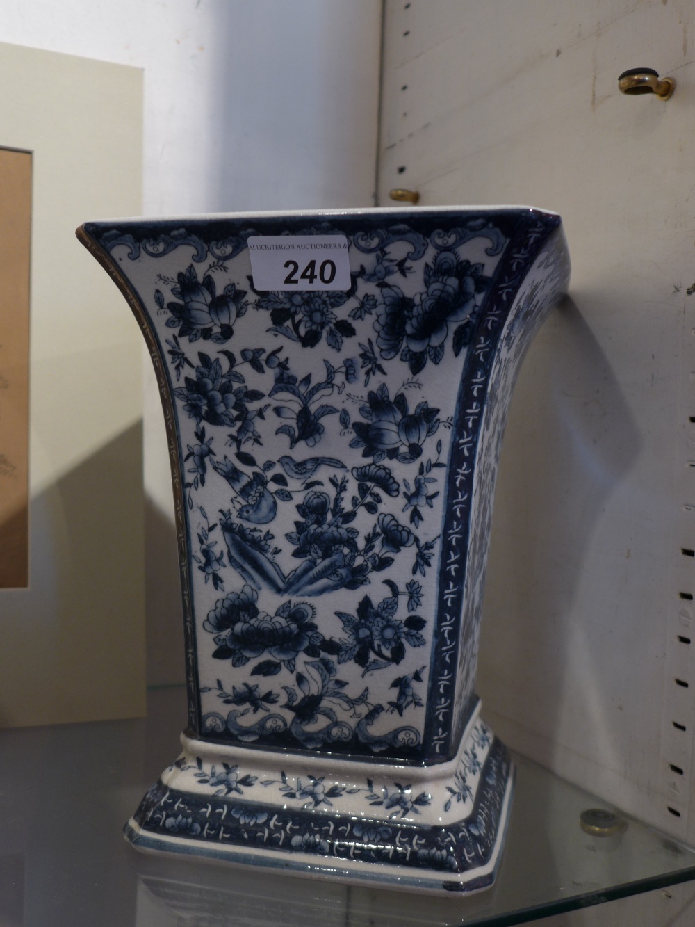 A splayed-top blue and white vase decora