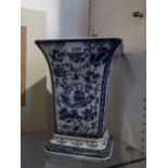 A splayed-top blue and white vase decora