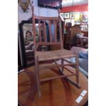 A Shaker style beech rocking chair with