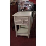 A painted pine bedside table fitted two