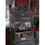 A Dutch repousse style wall mirror the s