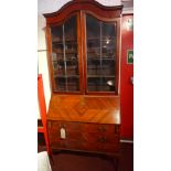 An Edwardian mahogany bureau bookcase fi