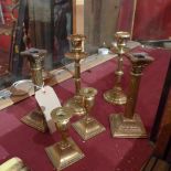 Three pairs of brass candlesticks of var