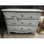 A Louis XV style grey painted commode of