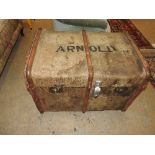 A vintage trunk stamped 'Arnold'