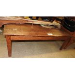 A 19th Century elm low table, the plank
