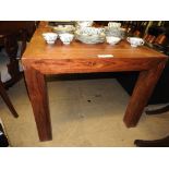 A contemporary teak dining table, the pl