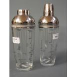 A pair of glass cocktail shakers with ch