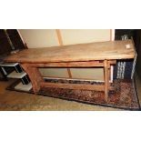 A vintage elm trestle table, the plank t