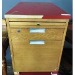 A pair of vintage retro red filing cabin