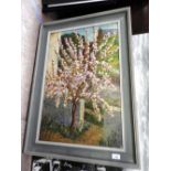 An Impressionistic oil on canvas of a tree in blossom,