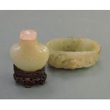 A 19th Century Jade brush washer of ovoid form with deeply carved with lizard decoration,