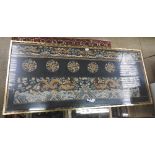 A framed and glazed Chinese silk panel having dragon pictoral detailing,