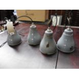 A set of four industrial grey pendant lamps