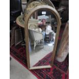 A small giltwood overmantel having arched plate