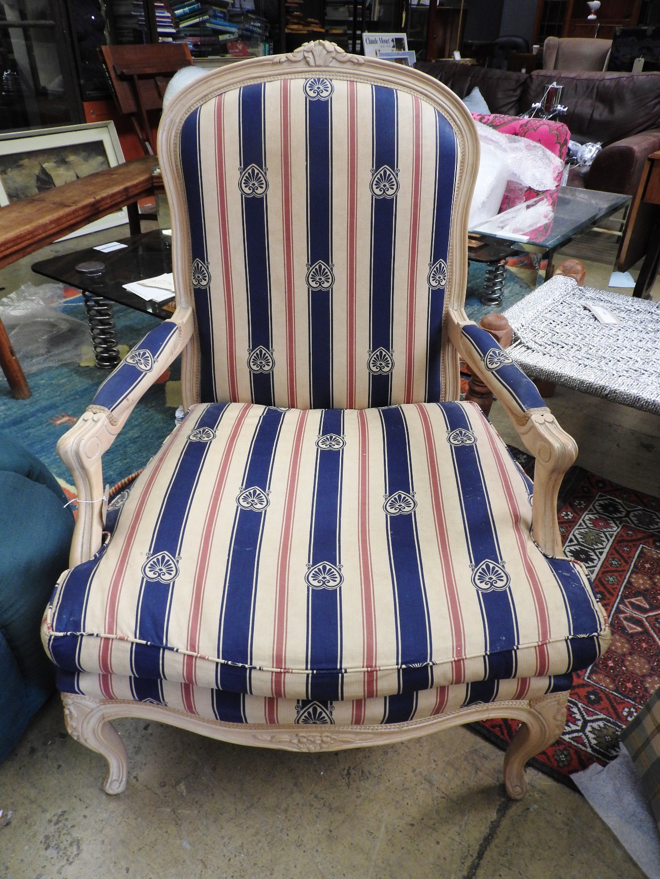 A french fauteuil open armchair with upholstered fabric