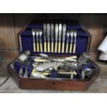 A boxed canteen of cutlery, a collection of other boxed cutlery, a scoop,