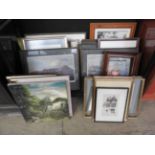 A collection of various framed pictures,