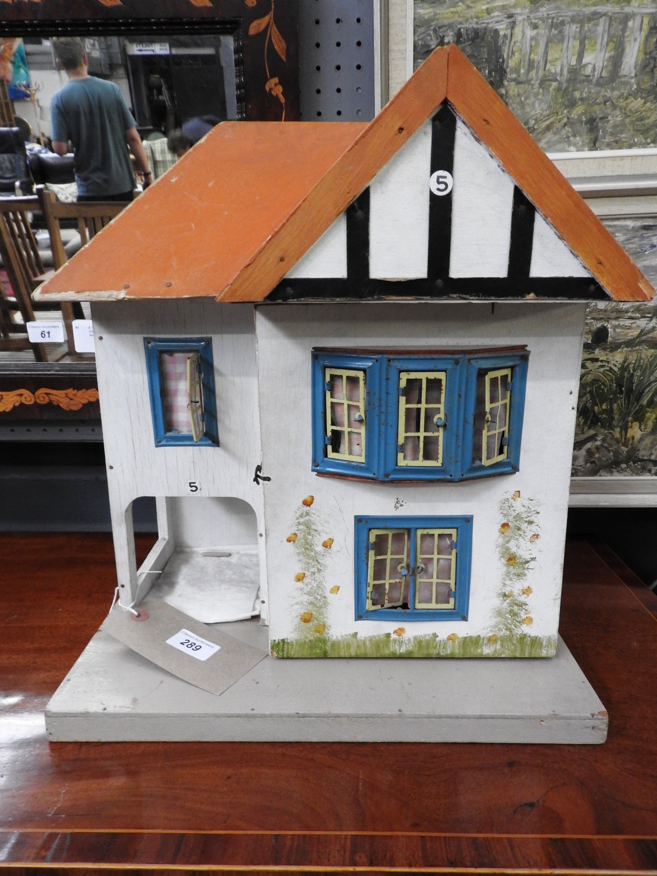 A wooden two storey doll's house in the Suburban style ,