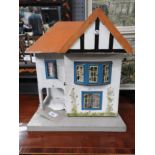 A wooden two storey doll's house in the Suburban style ,