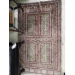A Bokhara rug, the all over terracotta geometric design on olive ground within corresponding border,