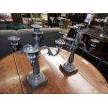 A pair of silver plated neo-classical style candelabra,