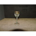 An 18th Century style wine glass with faceted stem and an 18th Century arle glass