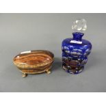 A blue flash glass decanter and onyx box