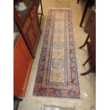 A Persian style hand knotted runner