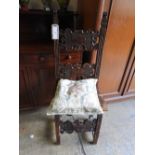 An 18th century oak side chair with carv