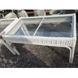 A pair of white painted wicker tables wi