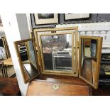 A tryptich mirror with gilt frame, along