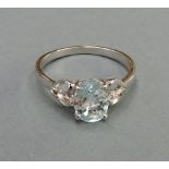 A silver ring having aquamarine cut crys