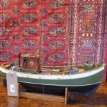 A hand made and painted remote control boat,