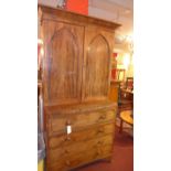 A Regency mahogany secretaire bookcase the angular cornice above pair of arched panel doors above