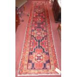 A fine north east Persian Heriz Runner 320cm x 80cm repeating stylised geometrical motifs within