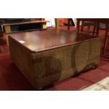 A retro low table / ottoman with rising lid, box compartment and corded fabric upholstered sides,