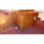 A pair of retro light oak chests fitted two drawers raised on square section supports