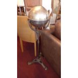 A 20th century silver plated napkin holder of spherical form and with retracting lid,