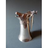 A silver plated stirrup cup with cast deer head form base.