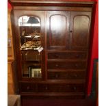 A Victorian walnut wardrobe fitted pair of panelled doors enclosing slides above five drawers and