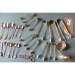 A collection of hallmarked silver items including sugar tongs and coffee spoones