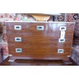A military style mahogany and brass bound low chest with tooled leather top above three short and