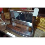 An Edwardian inlaid mahogany swing frame toilet mirror having a single drawer.