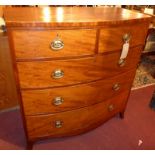 A Georgian mahogany bowfront chest fitted two short and three long drawers with brass handles on